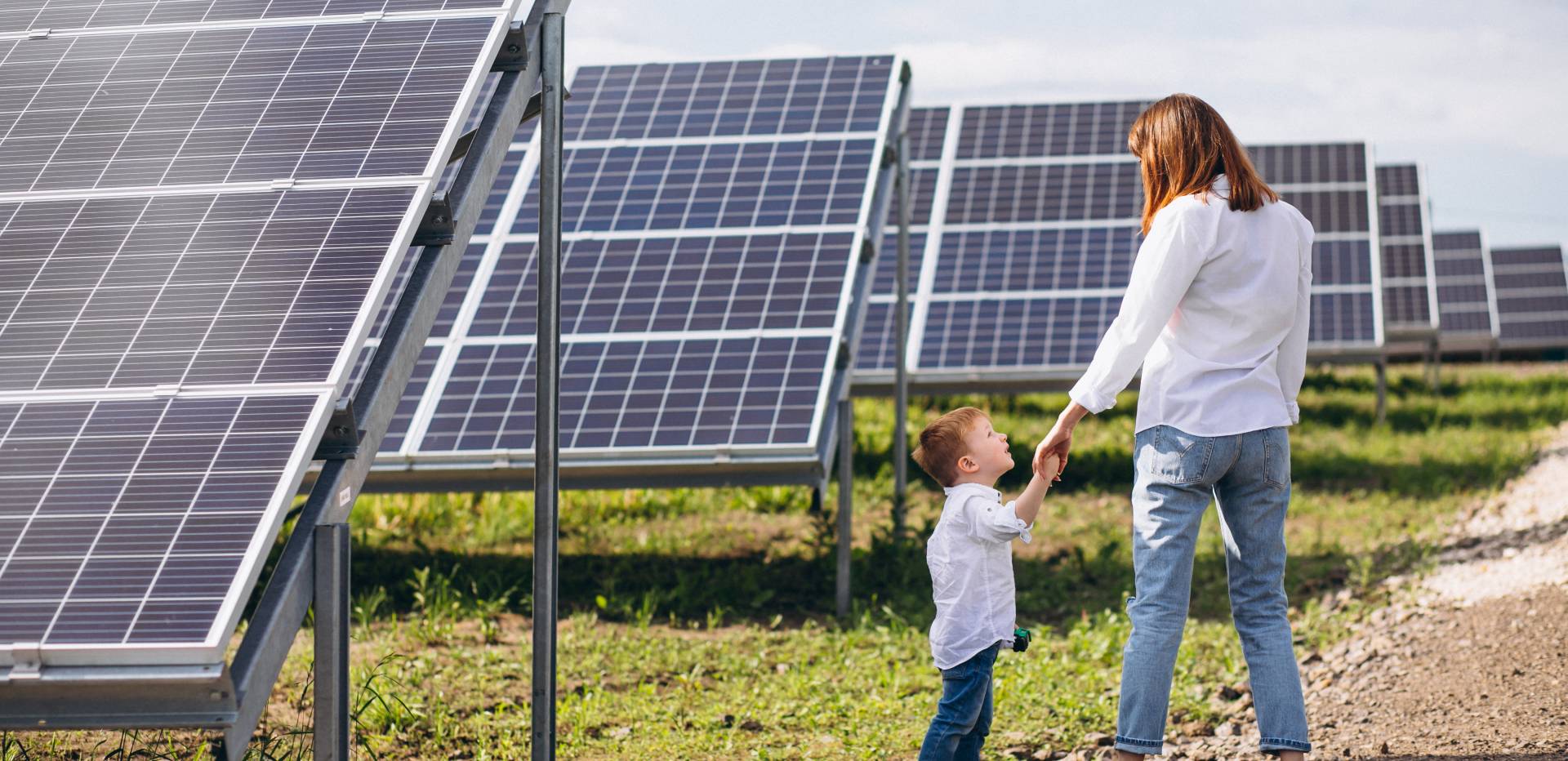 mother-with-her-little-son-by-solar-panels